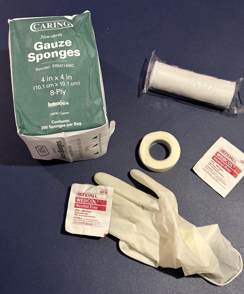 Gauze, medical tape, antiseptic wipes and gloves.