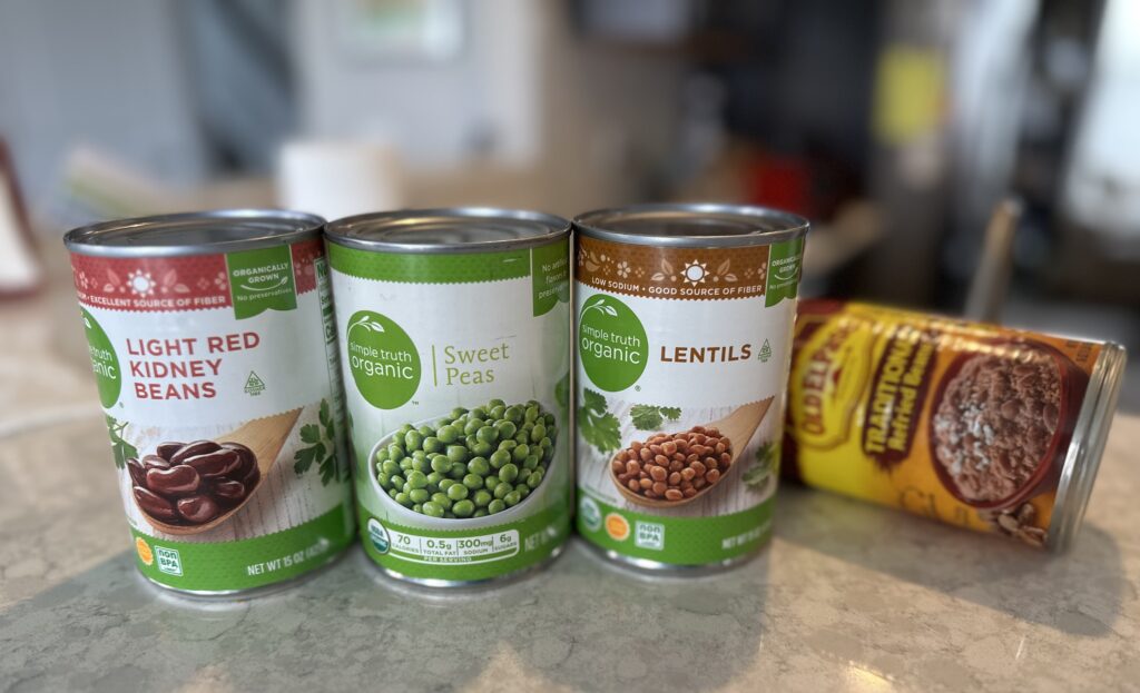 Assortment of canned kidney beans, peas, refried beans and lentils. Look at the can to see how long do the beans last. It should have a best by date or expiration.