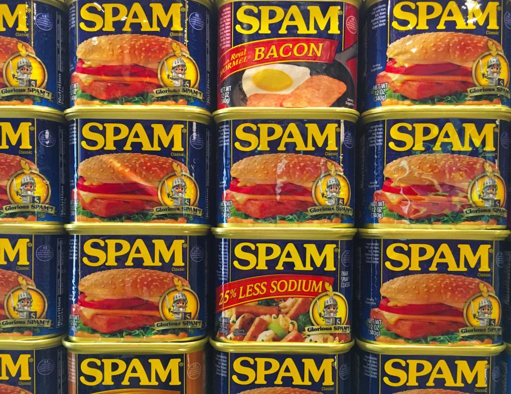 Cans of SPAM stacked on top of one another. How long does SPAM last?