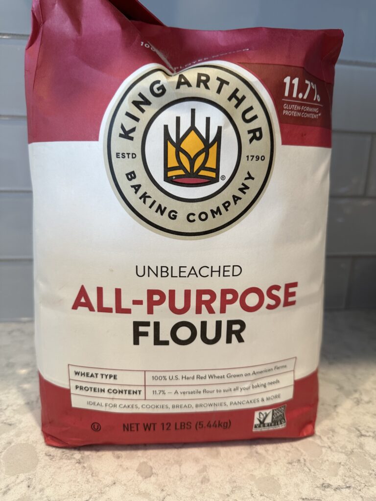 Photo of a large bag of King Arthurs Unbleached all purpose flour.