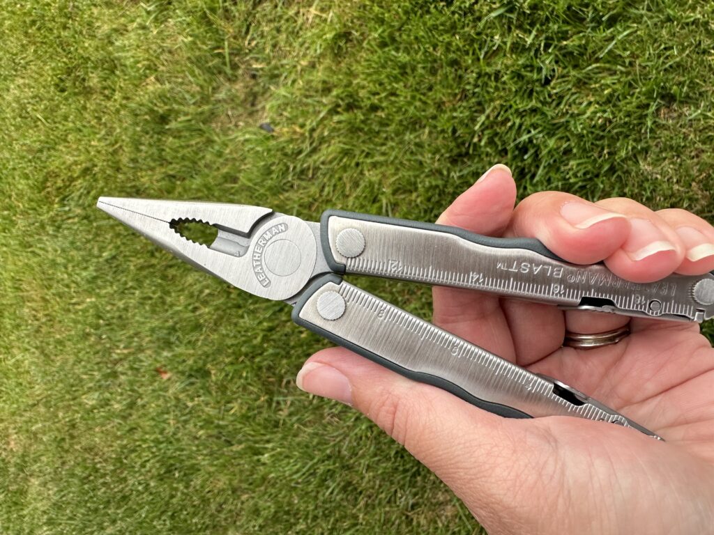 Photo of a Leatherman multi-tool in hand.