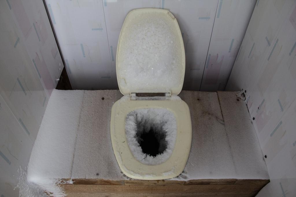 Photo of a frozen off grid toilet.