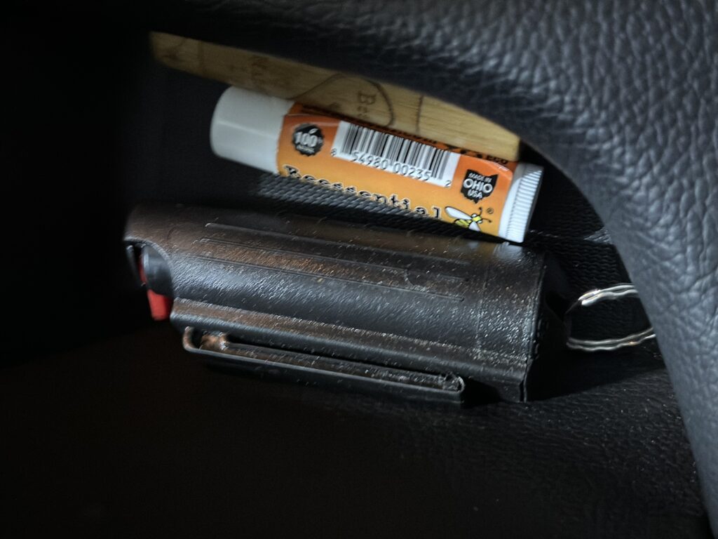 Photo of pepper spray stashed in a car door.