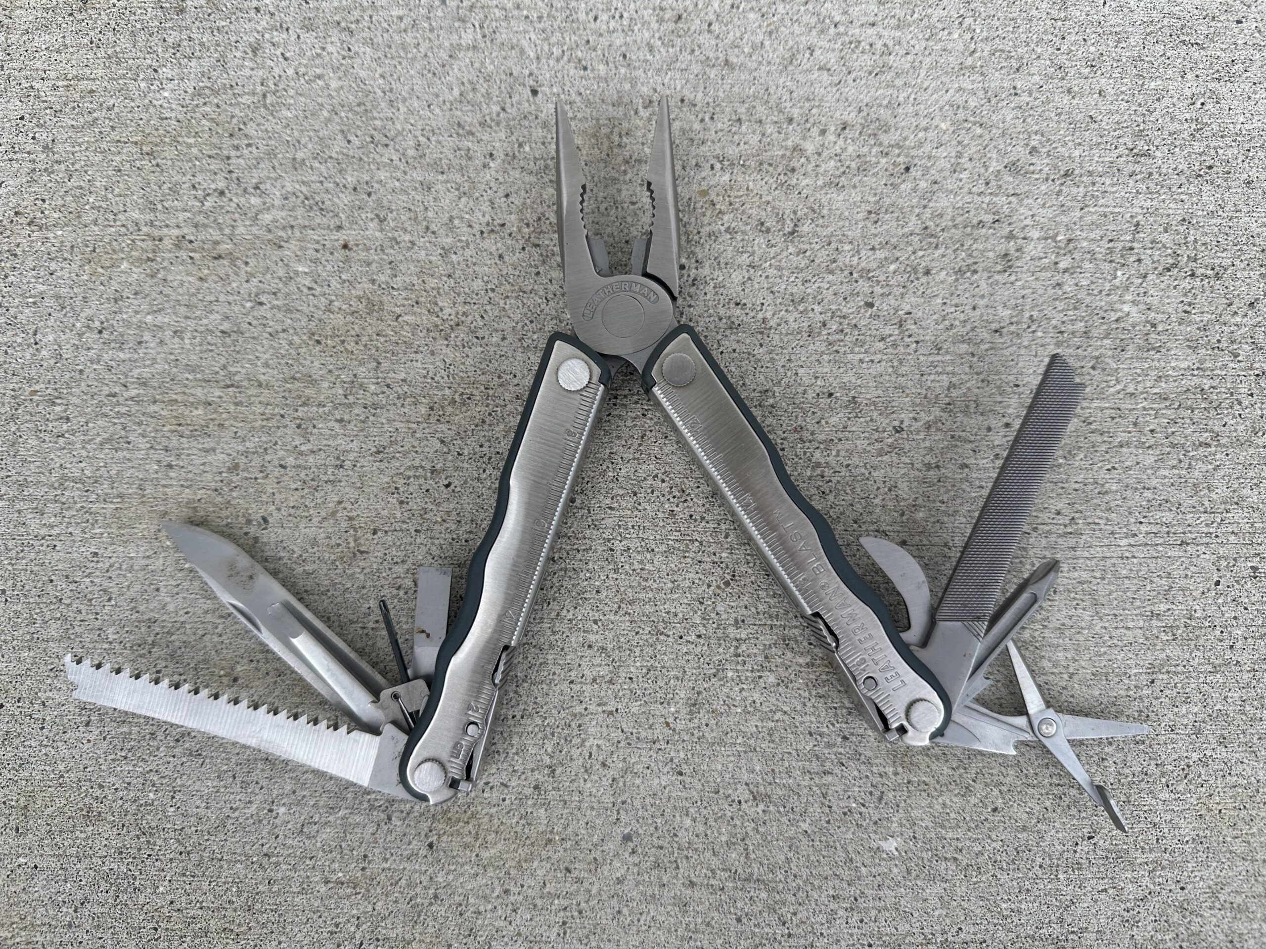 Image of a multitool opened with all the tools out.